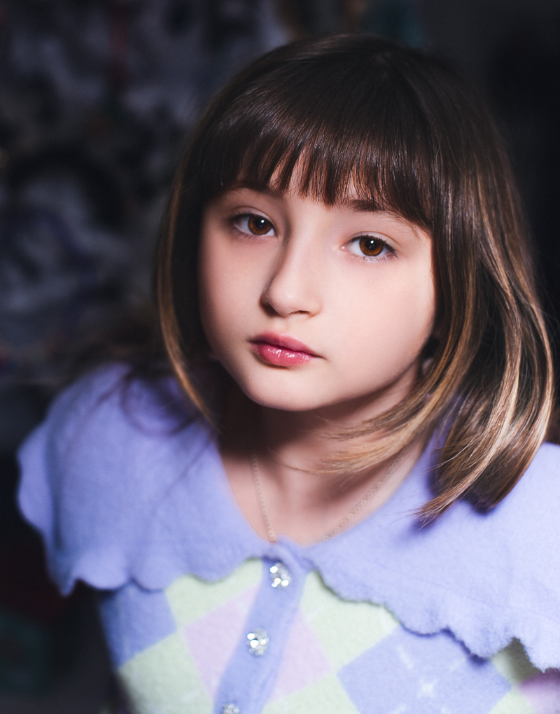 Portrait of a girl in purple and yellow sweater