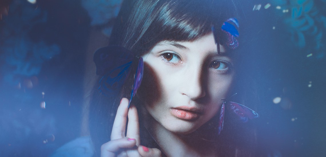 Girl with butterflies on her face